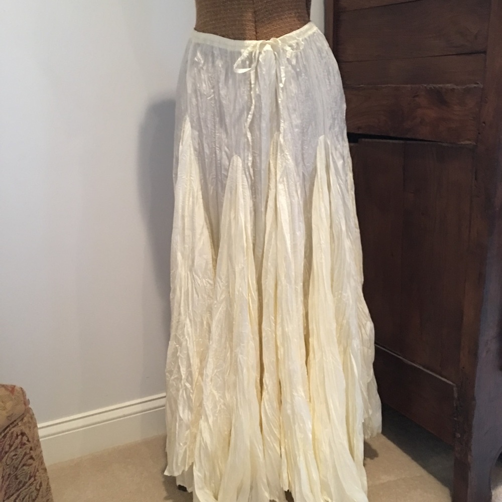 Cream colored satin look skirt.